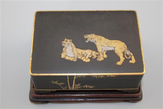 A Japanese gold and silver inlaid iron box and cover, signed Komai, Meiji period, 11cm, rosewood stand